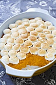 Sweet potatoes with marshmallows in baking dish