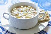 New England Clam Chowder in White Bowl; Crackers