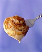 Pastry Dipped in Sauce on Fork
