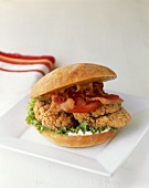Fried Chicken Sandwich with Bacon and Tomato on a Roll