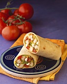 Chicken Salad Wrap; Halved on a Plate; Tomatoes