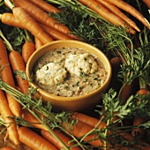 Bowl of Vegetable Soup with Dumplings; Fresh Carrots