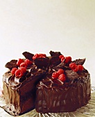 Chocolate Cake with Raspberries and Chocolate Leaves; Sliced