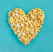 A popcorn heart on a blue surface