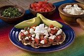 Tostada with Beans, Tomato and Cheese; Fresh Avocado