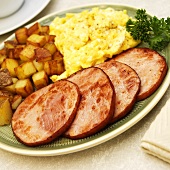 Breakfast Plate; Fried Canadian Bacon, Eggs and Home Fries