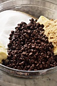 Chocolate Chip Cookie Ingredients in a Glass Mixing Bowl