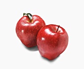 Two Red Delicious Apples on White
