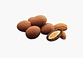 Chocolate Covered Almonds Dusted in Cocoa Powder; One Half; Almonds; White Background