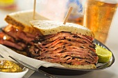 Halved Pastrami Sandwich with Pickle