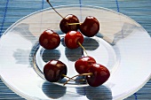 Fresh Red Cherries on Glass Plate