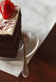 Piece of Chocolate Cake with Strawberry Garnish