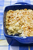 Cheesy Cauliflower Casserole in Baking Dish; Scoop Removed
