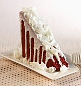 Slice of Red Velvet Cake with White Chocolate Shavings