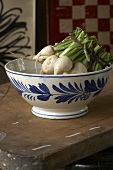 Fresh White Radishes Bundled in a Hand Painted Bowl