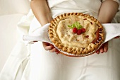 Woman Holding Freshly Baked Fruit Pie