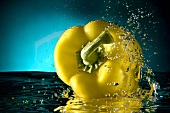Yellow Bell Pepper Splashing in Water