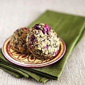 Sweet Potato and Cranberry Quinoa Cakes on a Plate; On Green Folded Napkin
