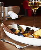 Seafood Dish of Mussels, Shrimp and Fish with Bread Slices; White Wine