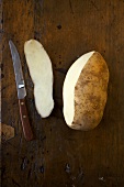 Partially Peeled Idaho Potato; Knife
