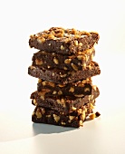 Chocolate Nut Brownies; Stacked on White Background