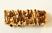 Chocolate Chip Oat and Rice Bar with Chocolate Drizzles; White Background; From Above