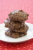 Three Chewy Chocolate Cookies Stack on a Plate