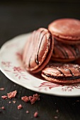 Pink Macaroons on a Plate; Crumbs