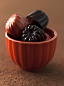 Caramel and Chocolate Truffles in a Small Orange Bowl from Bakery Nouveau in Seattle Washington