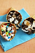 Three S'mores Ice Cream Cones with Assorted Toppings