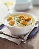Bowl of Creamy Potato Cauliflower Soup with Croutons