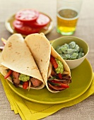 Beef Fajitas with Onions and Peppers and Guacamole
