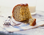 Piece of Lemon Poppy Seed Cake with a Glass of Milk; Forks