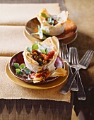 Puff pastry cups filled with an aubergine medley (aubergine, peppers and oregano)