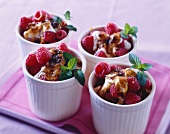 Caramelised vanilla puddings with raspberries and mint