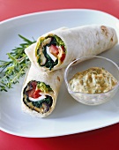 Tofu, aubergine and spinach wraps with dressing