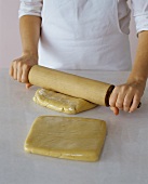 Rolling Out Sugar Cookie Dough that is Wrapped in Cellophane