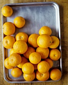 Whole Oranges on a Baking Sheet