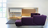 A purple corner sofa in an elegantly designed living room