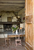 Open front door with a view of the dining room and fireplace