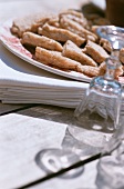 Empty wine glasses and sandwiches on a plate