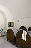 Vaulted ceiling in a bedroom with antique wooden beds