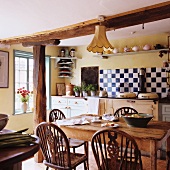 A rustic dining table and chairs in a country house