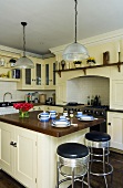 Breakfast for two on a kitchen counter in a light-painted kitchen in a country house