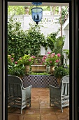 View into the green oasis of a Mediterranean patio