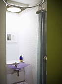 Bathroom with a wash basin and a shower area