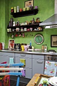 Modern green kitchen with grey units