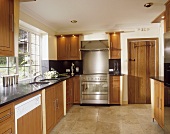 Shelving unit in dark wood in kitchen