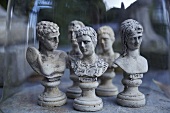 Chess figures made of stone under a bell jar