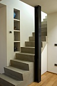 Concrete steps with a pillar in an open-plan living room